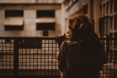 woman-holding-on-railings-2935814.jpg