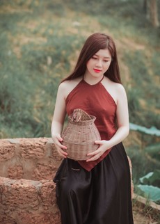 woman-in-red-top-sitting-on-a-water-well-1386599.jpg