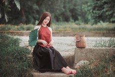 woman-sitting-on-gray-concrete-surface-1386600.jpg