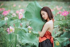 woman-wearing-halter-neck-top-holding-leaf-1322140.jpg