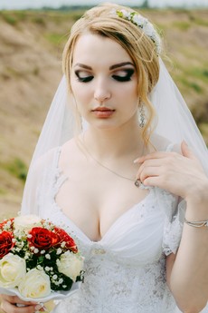 woman-wearing-white-lace-surplice-neck-wedding-gown-1393477.jpg