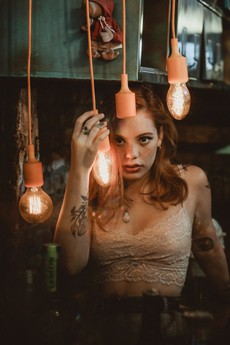 woman-holding-lighted-pendant-lamp-2872242.jpg