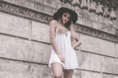 woman-in-white-sleeveless-dress-and-hat-near-wall-848542.jpg