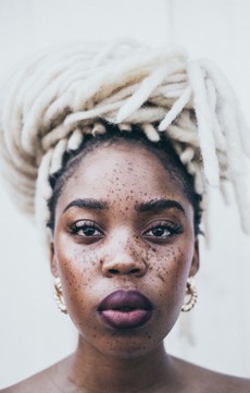portrait-photo-of-freckled-woman-with-white-braids-posing-3078089.jpg