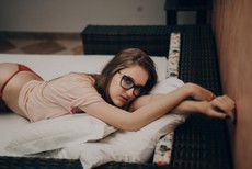 woman-lying-in-beige-crew-neck-shirt-1005866.jpg