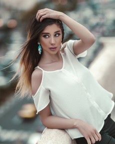 photo-of-woman-leaning-on-concrete-railing-3015351.jpg