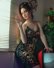 photo-of-woman-leaning-on-the-wall-beside-window-2587390.jpg