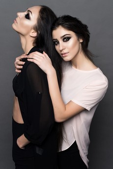 woman-in-white-crew-neck-t-shirt-embracing-woman-in-black-160599.jpg