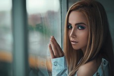 woman-leaning-on-glass-window-2829365.jpg