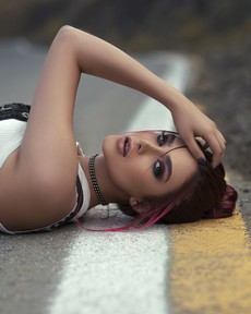 woman-lying-on-road-2803944.jpg