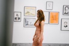 woman-standing-near-paintings-on-wall-1429522.jpg