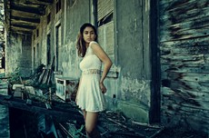 photo-of-woman-wearing-white-dress-standing-near-abandoned-792531.jpg