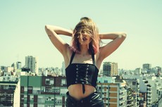 woman-holding-her-head-wearing-black-sleeveless-crop-top-816235.jpg