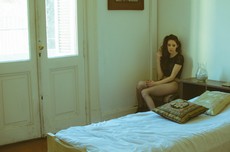 woman-wearing-black-cap-sleeved-top-sitting-on-chair-near-839775.jpg