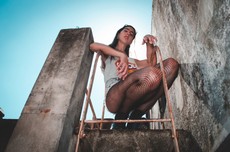 woman-wearing-gray-tank-top-sitting-on-red-ladder-878677.jpg