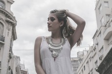 woman-wearing-white-tank-top-holding-hair-pose-848541.jpg